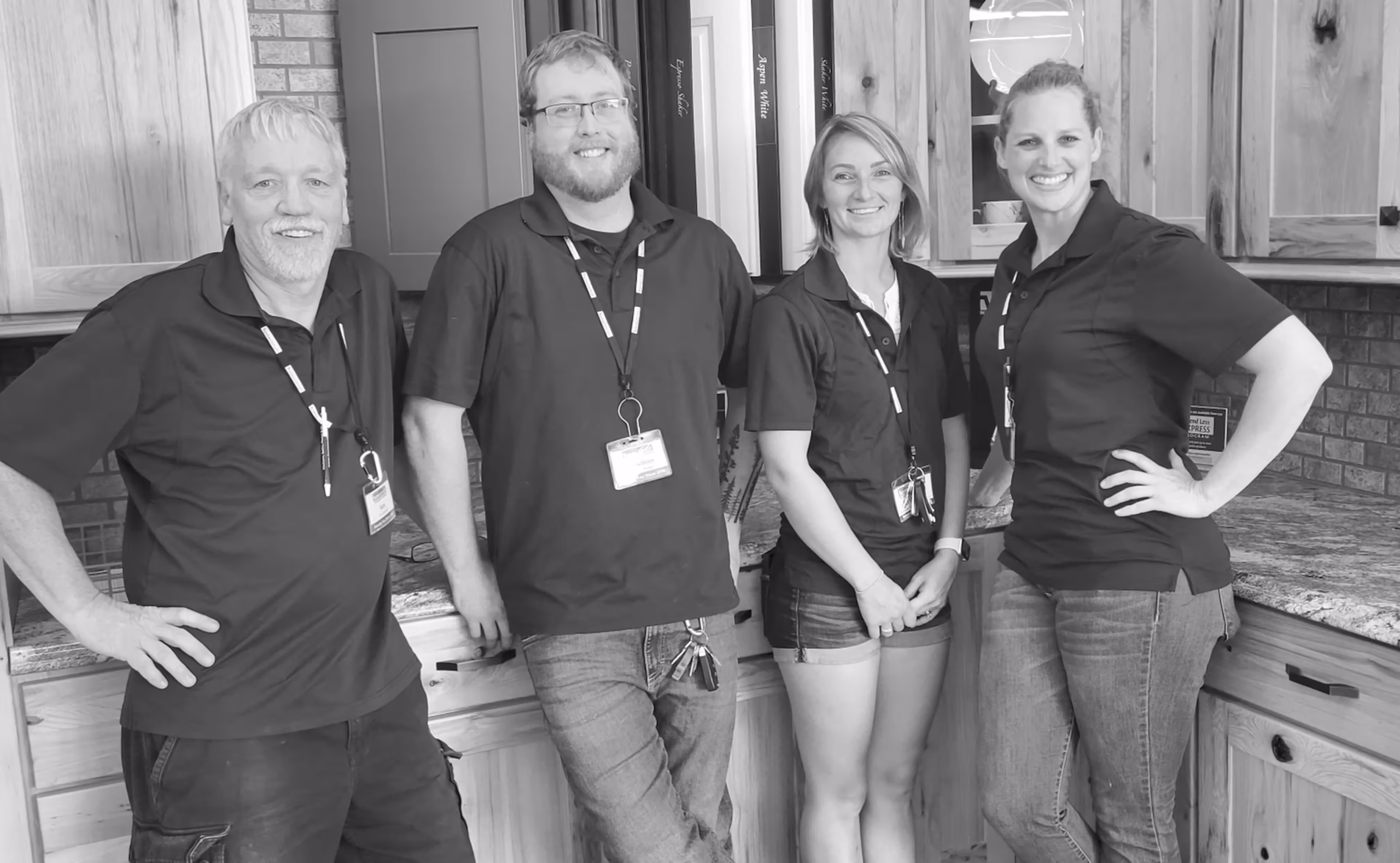 Home Outlet Partners standing in an in-store kitchen display